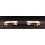 PAIR FROSTED AND CUT GLASS OVAL BUTTER DISHES EACH in silver oval stand with bead and bar