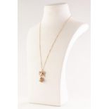 9ct Gold BELL PENDANT, ON CHAIN. As a pierced bell to a bow, chain length, 49cm, 6.25g Good