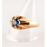 18 ct GOLD RING WITH A BLUE IOLITE STONE in a raised six claw setting. London import hallmark