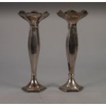 A PAIR OF INTER-WAR YEARS WEIGHTED SILVER FLOWER VASES OF HEXAGONAL SHAPE, with petal shaped rim,