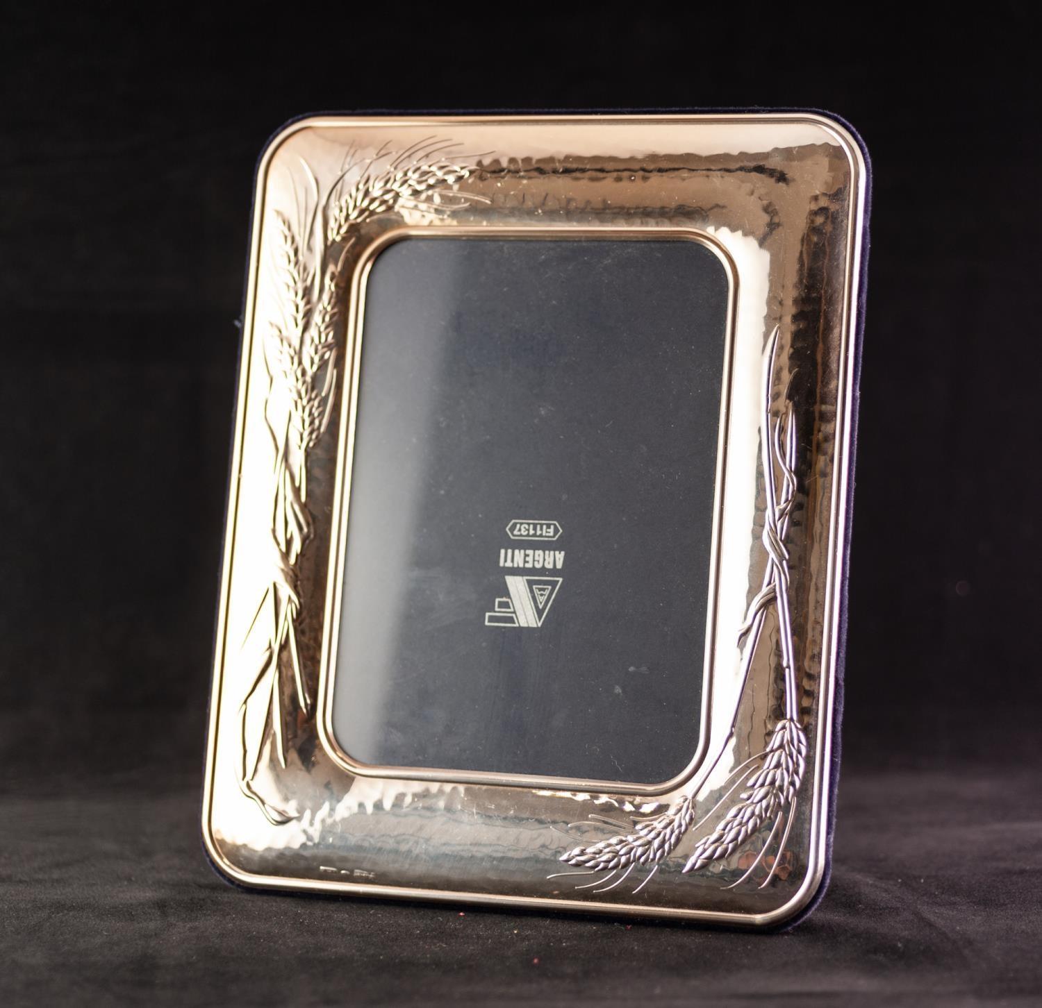 MODERN 925 MARK SILVER COLOURED METAL CLAD PHOTO FRAME of rounded oblong form and embossed with