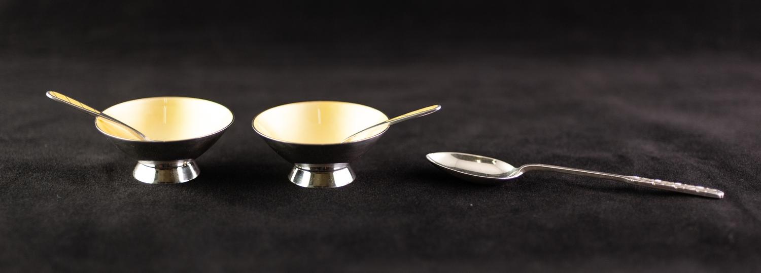 PAIR MID 20th century SILVER AND ENAMELLED CIRCULAR OPEN SALTS AND SPOONS yellow interior to the