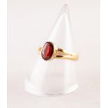 VICTORIAN 22ct GOLD DRESS RING, collet set with an oval red stone, Birmingham 1881, 2.2gms, ring