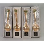 FOUR MODERN GEORG JENSEN SILVER GILT AND ENAMELLED FLOWER SPOONS, 1975, in original boxes (4)