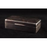 SMALL GEORGE V SILVER CIGARETTE BOX, oblong, the slightly rounded hinge top with engine turned