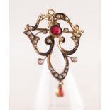 GOLD COLOURED METAL OPEN WORK SCROLL BROOCH/PENDANT, collet set with centre red stone and numerous