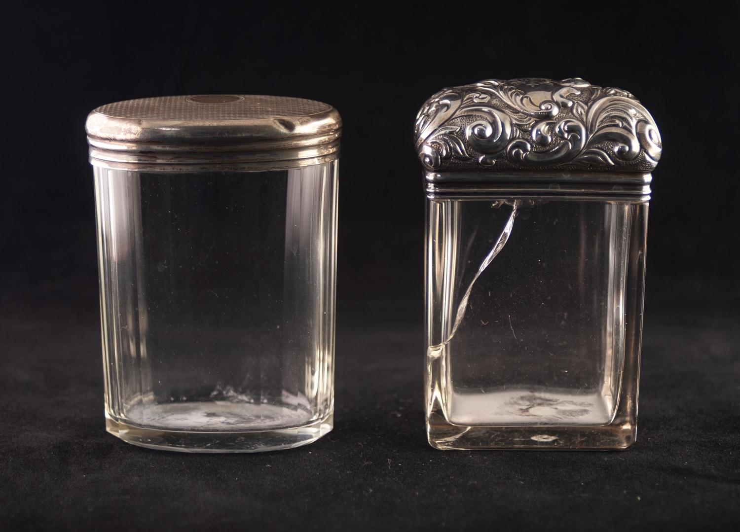 A LATE VICTORIAN SILVER TOPPED RECTANGULAR DRESSING TABLE JAR, well chased with foliate scrollwork