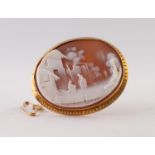 CARVED SHELL CAMEO BROOCH, depicting two female figures before a farm dwelling, in a chased frame,