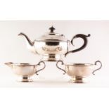 GEORGE V SILVER THREE PIECE TEA SET circular with circular foot and having beaded edges the teapot