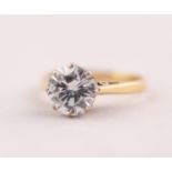 18 ct GOLD RING WITH A ROUND BRILLIANT CUT SOLITAIRE DIAMOND in an eight claw setting, approximately