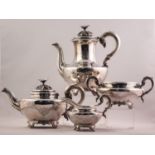 A WILLIAM IV SILVER FOUR PIECE TEA AND COFFEE SERVICE, each engraved with scrolliated cartouches,
