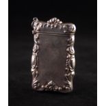 CONTINENTAL .925 MARK SILVER COLOURED METAL LARGE OBLONG VESTA BOX, the foliate scroll embossed
