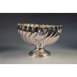 A LATE VICTORIAN SILVER WRYTHEN FLUTED PEDESTAL BOWL, centred with repousse scrollwork vacant