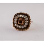 NINETEENTH CENTURY TOPAZ AND PEARL CLUSTER RING. A Cushion cut topaz in a collet setting within a