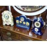 EARLY 20TH CENTURY MANTEL CLOCK IN BLUE GLAZED POTTERY CASE OF WAISTED FORM WITH GILT METAL