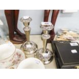 A PAIR OF ELECTROPLATE CANDLESTICK STANDS (2)