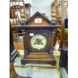 CIRCA 1900 WOODEN CASED MANTEL CLOCK with circular arabic dial, 14" (35.5cm) high