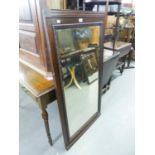 A LARGE RECTANGULAR BEVELLED EDGE ROBING MIRROR, THE FRAME WITH CARVED INNER SURROUND 4'2" X 2'5"