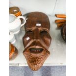 AN AFRICAN ABORIGINAL CARVED WOODEN MASK, MAN WITH LOWER FANGS