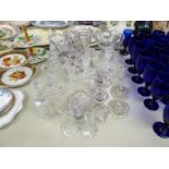 SELECTION OF GLASS WARES TO INCLUDE CANDLE HOLDERS, GLASS BELLS, TWO HANDLE CUT GLASS VASES, ETC. (