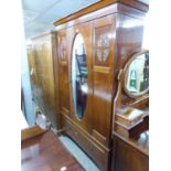 EARLY 20th CENTURY BEDROOM SUITE OF THREE PIECES COMPRISING A WARDROBE WITH SINGLE OVAL MIRROR PANEL