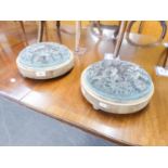 A pair of late 19th/early 20th Century tambour stools, of circular top with beaded detail, on bun