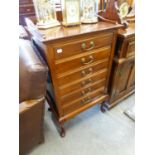 A MAHOGANY MUSIC CABINET WITH SIX FALL-FRONT DRAWERS