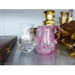 AN EARLY 20TH CENTURY BROWN GLASS JAR WITH THREE SCROLL HANDLES AND PINK AND WHITE DETAIL, 3 1/2"