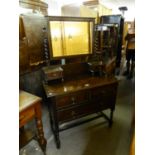 EARLY 20th CENTURY CARVED WALNUT WOOD DRESSING TABLE WITH OBLONG BEVELLED EDGE SWING MIRROR