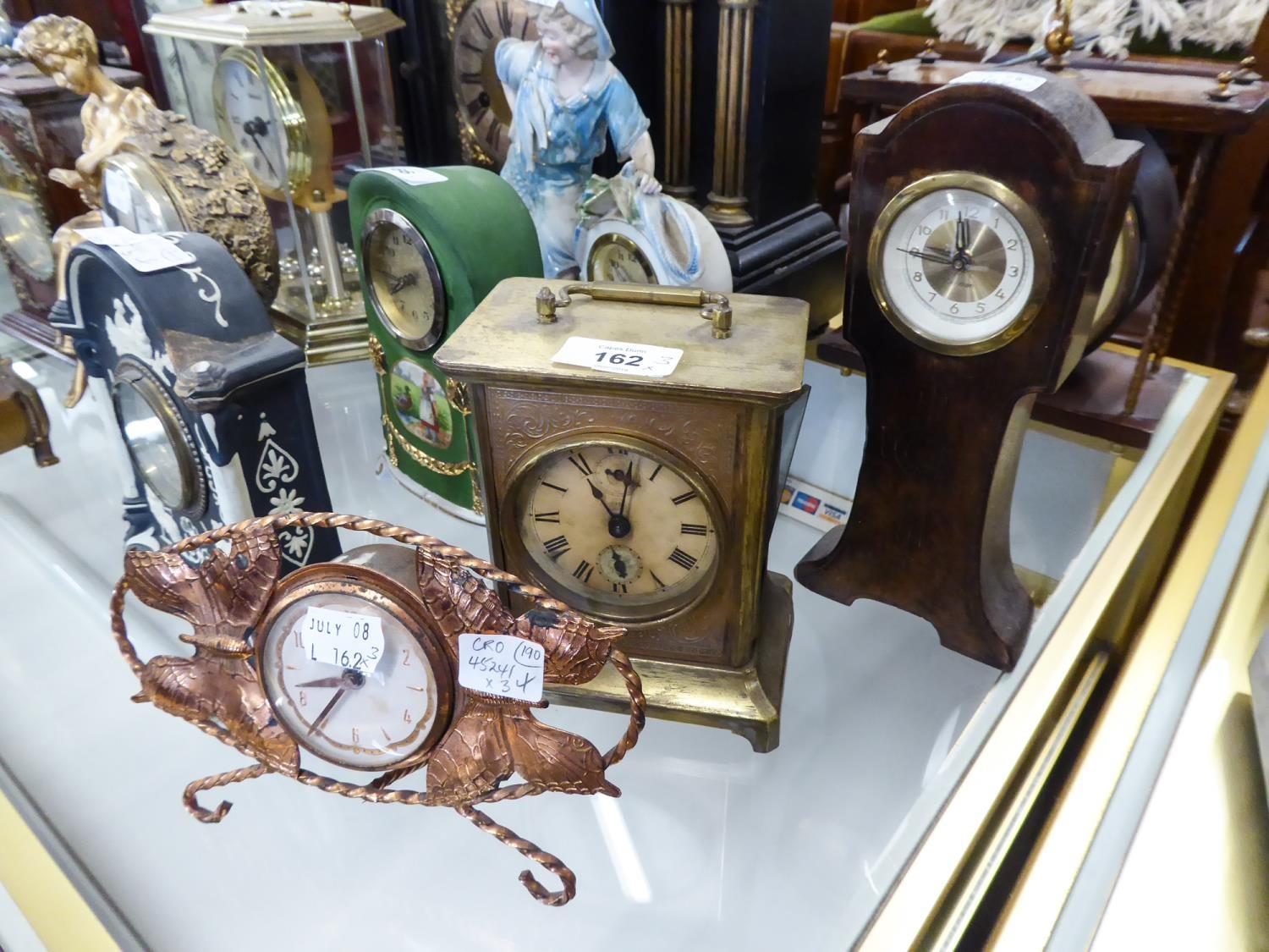 EARLY 20TH CENTURY PRESSED GILT METAL CARRIAGE TYPE MANTEL ALARM CLOCK HAVING BALANCE WHEEL