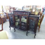 LATE VICTORIAN CARVED DARK MAHOGANY DISPLAY CABINET WITH STEPPED TOP, THE CENTRE SECTION ENCLOSED BY