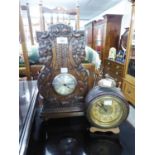 CIRCA 1920's TALL MANTEL CLOCK WITH PLATED DRUM SHAPED 8 DAY MOVEMENT IN OAK CASE WITH FOLIATE AND