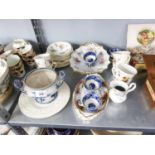 A group of porcelain wares to include a French tea service with floral detail, Anysley fruit dish, a