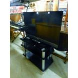 SONY FLAT SCREEN TELEVISION 31" AND BLACK GLASS STAND