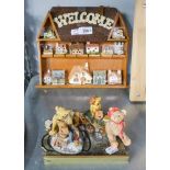 A COLLECTION OF MODERN POTTERY TEDDY BEAR FIGURES WITH ADVERTISING BOARD AND A COLLECTION OF