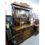 LATE VICTORIAN CARVED MAHOGANY DRESSER SIDEBOARD WITH HIGH MIRROR CANOPY BACK, THREE PIANO FRONTED