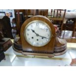 1930s WALNUT CASED MANTEL CLOCK with swept corners, 18 1/2" (47cm) long