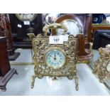 CIRCA 1900 CAST BRASS 'FIRE-SCREEN' FORM BEDROOM MANTEL-SHELF CLOCK, the arabic dial stamped