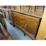 LARGE OAK SIDEBOARD WITH LEDGE BACK, THREE CENTRE DRAWERS FLANKED BY END CUPBOARDS, ON SIX SHORT