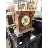 ANSONIA CLOCK CO - NEW YORK OAK CASE MANTEL CLOCK WITH GILT METAL AND ENAMEL TWO PART ROMAN DIAL NOW