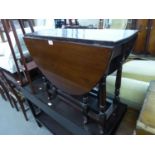 AN EDWARDIAN MAHOGANY DROP-LEAF GATELEG TABLE