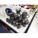 ?A SMALL SELECTION OF PEWTER MEASURES ALSO A TANKARD WITH A HINGED BEER MUG, INSCRIBED WITH