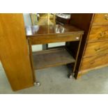 A TEA TROLLEY/CARD TABLE RAISED ON CASTORS