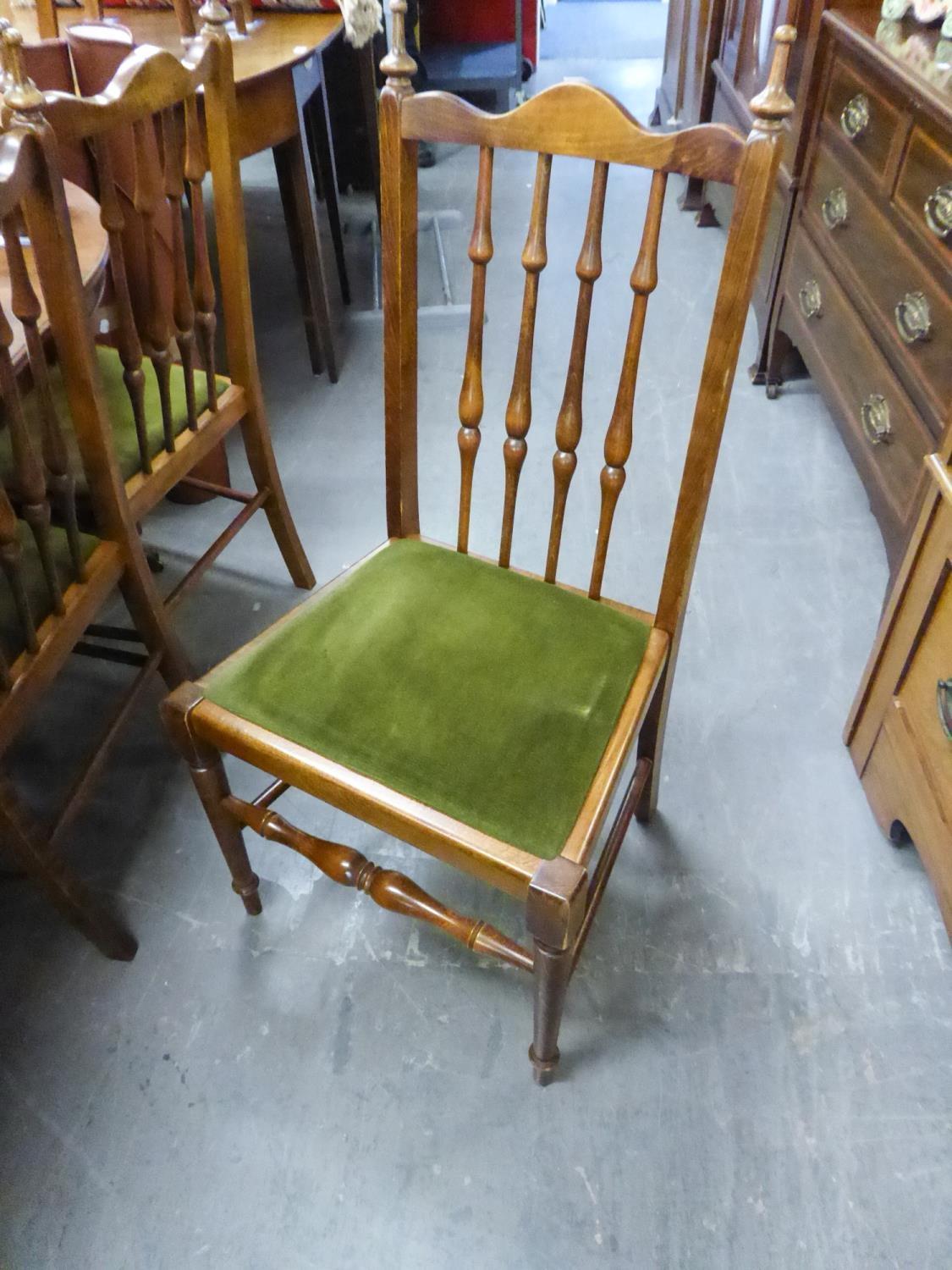 SET OF 10 HARDWOOD SINGLE CHAIRS EACH WITH TALL FIVE SPINDLE BACKS. DROP IN SEATS IN MOSS GREEN