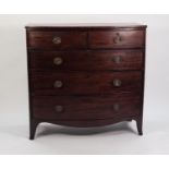 EARLY NINETEENTH CENTURY MAHOGANY BOW FRONTED CHEST OF DRAWERS, the shaped top above two short and
