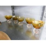 FIVE, CIRCA 1920S, FRUIT BOWLS, THE CLEAR GLASS BASES WITH BUBBLE DETAIL AND YELLOW GLASS BOWLS