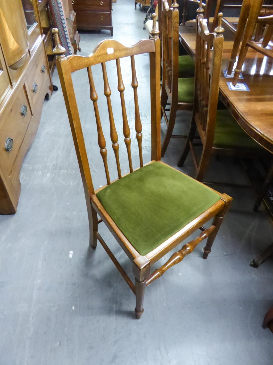 SET OF 10 HARDWOOD SINGLE CHAIRS EACH WITH TALL FIVE SPINDLE BACKS. DROP IN SEATS IN MOSS GREEN