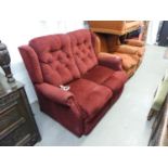 TWO SEATER RECLINING SETTEE, COVERED IN RED FABRIC