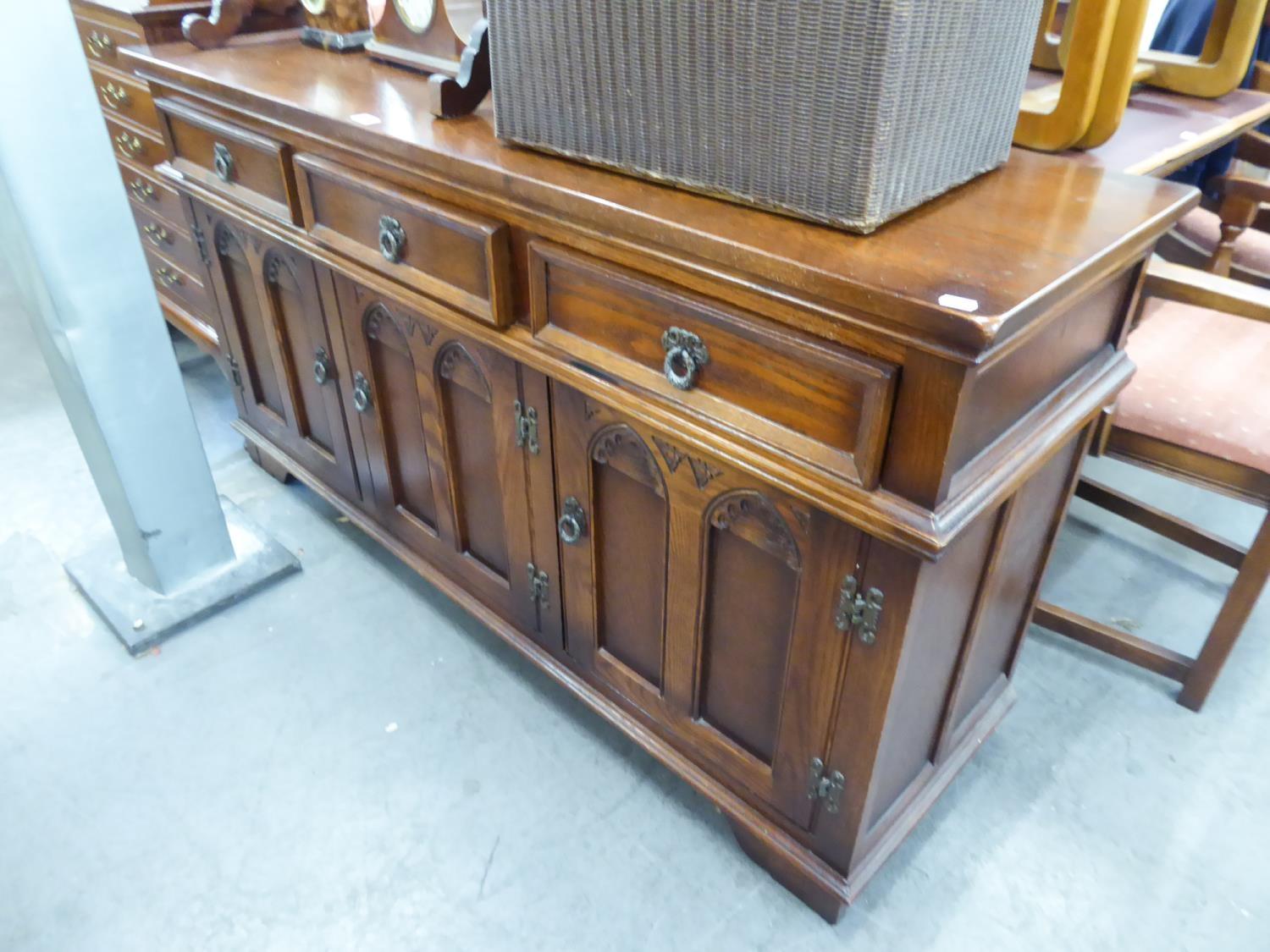 OLD CHARM DARK OAK DINING TABLE SUITE OF SIDEBOARD, TABLE AND SIX DINING CHAIRS (4 + 2) (8)