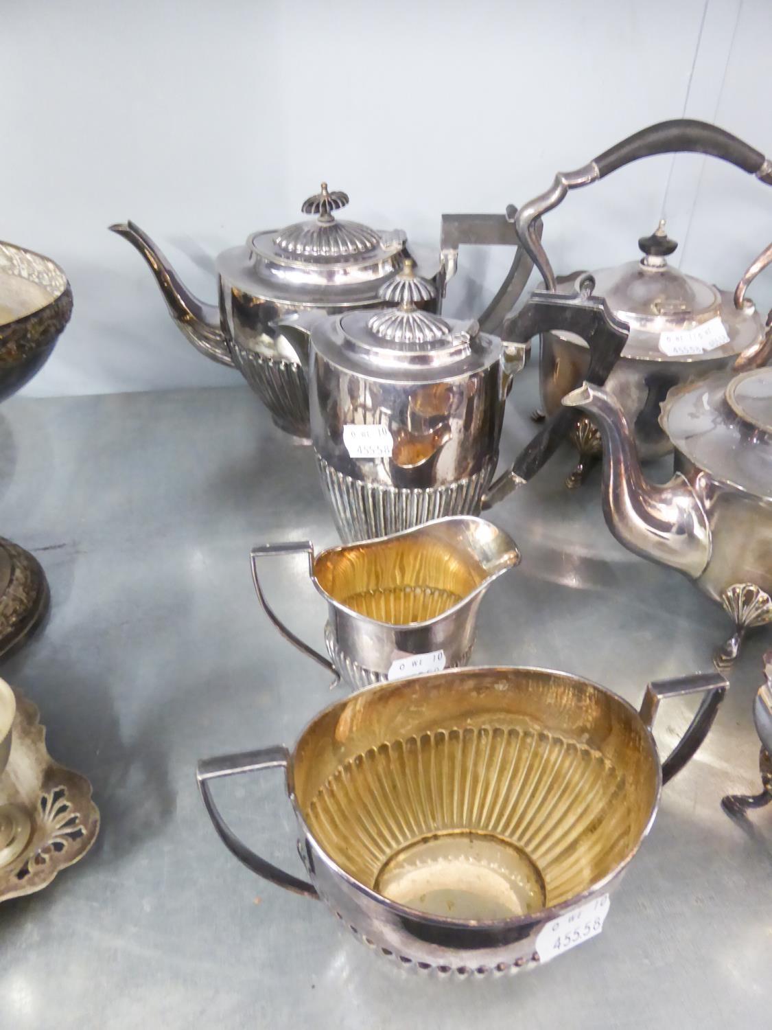 ELECTROPLATE COFFEE SERVICE OF FOUR PIECES HAVING HALF GADROONED DESIGN EBONISED HANDLES (4)